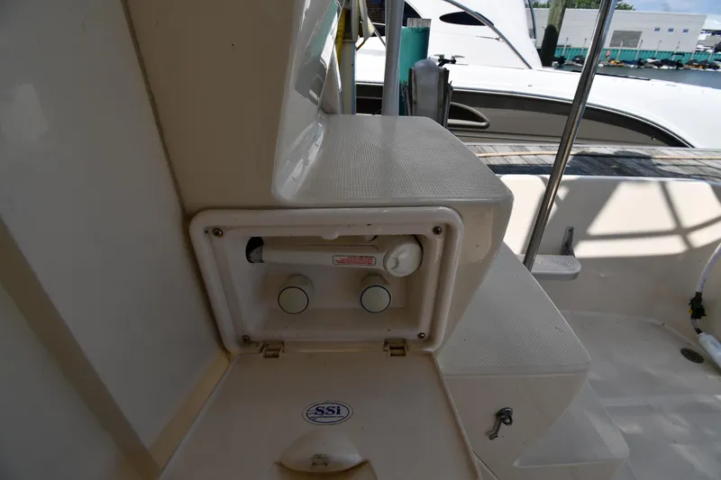 Make Me Smile Yacht Photos Pics 2006 Mainship 40 Trawler deck with storage compartment and marine equipment.