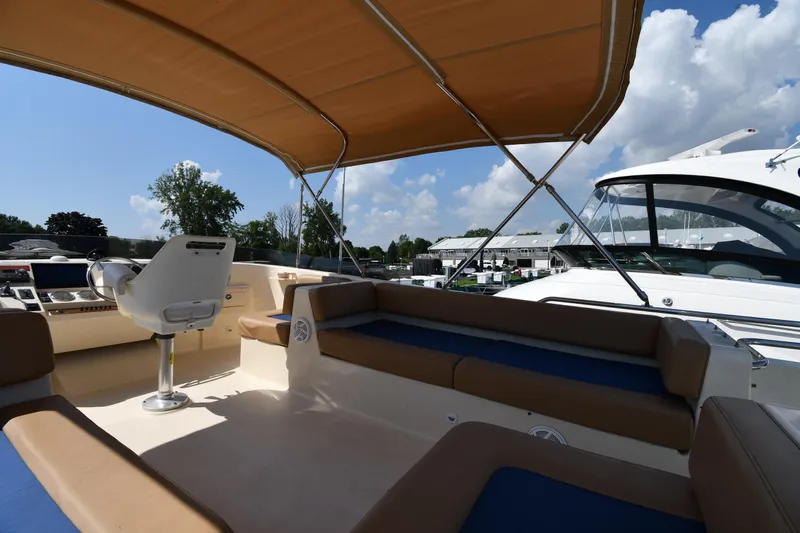 Make Me Smile Yacht Photos Pics 2006 Mainship 40 Trawler interior with seating and helm under canopy.