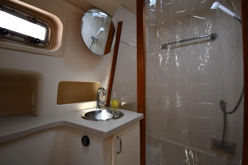 Make Me Smile Yacht Photos Pics Bathroom interior of 2006 Mainship 40 Trawler with sink and shower.