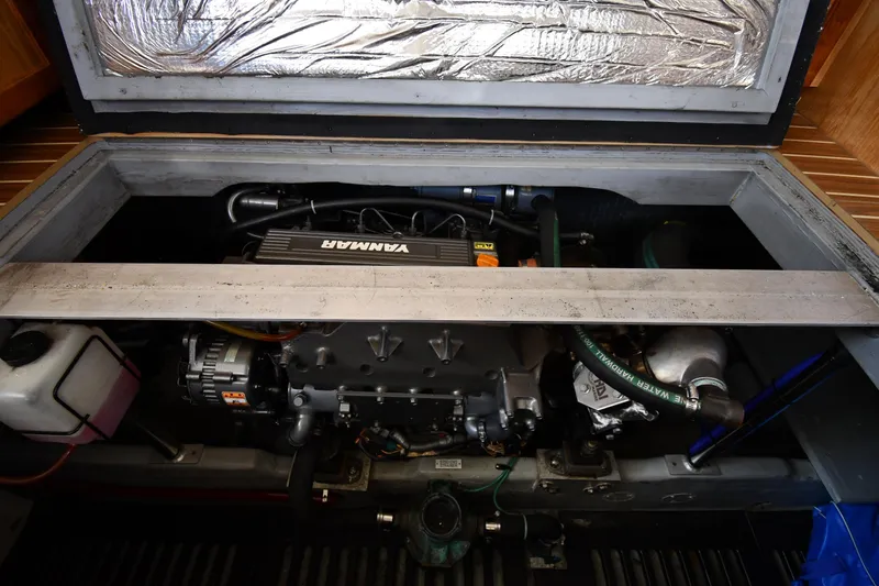 Make Me Smile Yacht Photos Pics Engine compartment of a 2006 Mainship 40 Trawler, featuring a Yanmar engine.