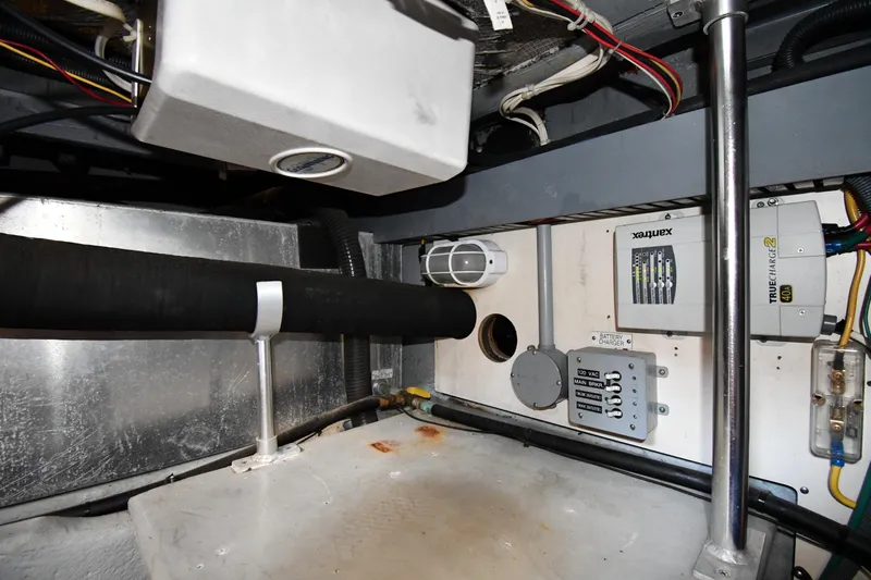 Make Me Smile Yacht Photos Pics Engine room of 2006 Mainship 40 Trawler with electrical components and wiring.
