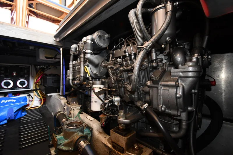 Make Me Smile Yacht Photos Pics Engine room of 2006 Mainship 40 Trawler, showcasing detailed mechanical components.