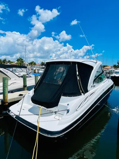 Seas The Day Yacht Photos Pics 2012 Cruisers 350 Express yacht docked at a marina on a sunny day.