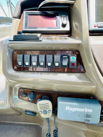 Seas The Day Yacht Photos Pics Control panel of a 2012 Cruisers 350 Express boat with Raymarine equipment.