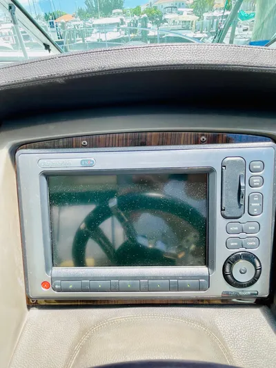 Seas The Day Yacht Photos Pics 2012 Cruisers 350 Express boat dashboard with navigation system.