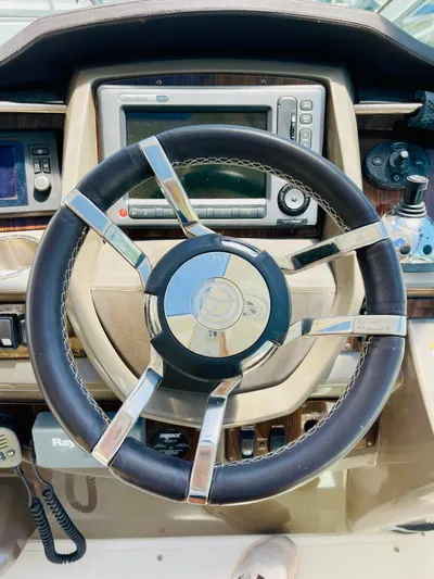 Seas The Day Yacht Photos Pics Steering wheel and dashboard of a 2012 Cruisers 350 Express boat.