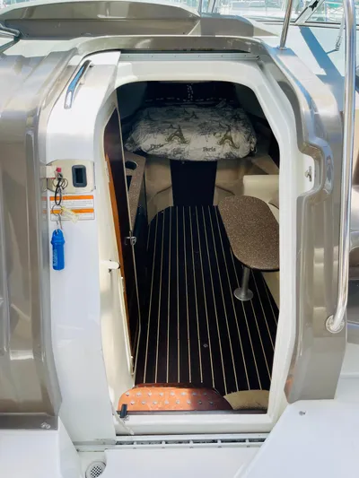 Seas The Day Yacht Photos Pics 2012 Cruisers 350 Express cabin interior with bed and seating area.