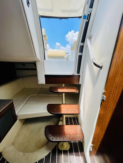 Seas The Day Yacht Photos Pics Interior stairs of a 2012 Cruisers 350 Express yacht with a view of the deck.