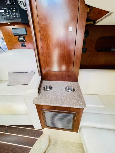Seas The Day Yacht Photos Pics 2012 Cruisers 350 Express cabin interior with seating and cup holders.