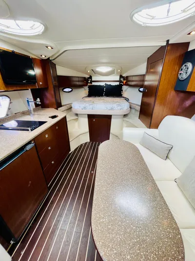 Seas The Day Yacht Photos Pics 2012 Cruisers 350 Express cabin interior with modern amenities and cozy sleeping area.