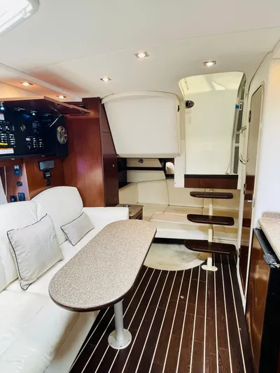 Seas The Day Yacht Photos Pics Interior of 2012 Cruisers 350 Express yacht with modern seating and wooden flooring.