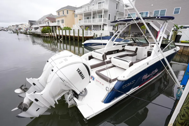 Plane To Sea Yacht Photos Pics 2022 Cobalt R8 boat docked, featuring Yamaha engines, in a residential waterfront setting.