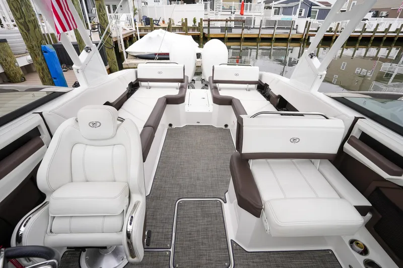 Plane To Sea Yacht Photos Pics Luxurious interior of 2022 Cobalt R8 boat with white seating and modern design.