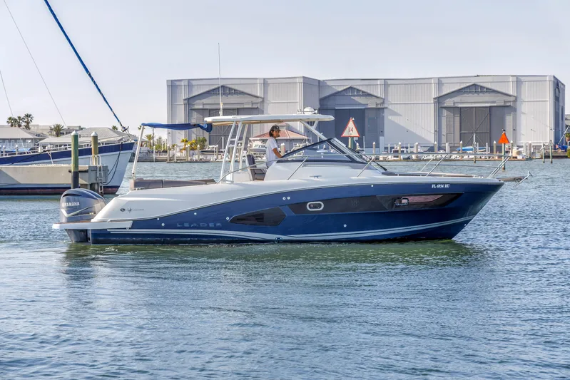 Yacht Photos Pics 2019 Jeanneau Leader 10.5 CC boat on water near marina.