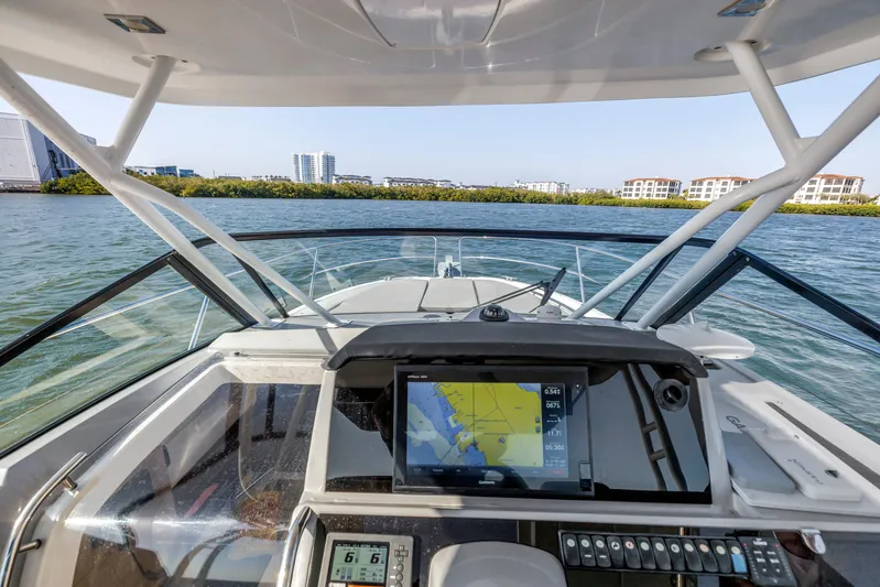  Yacht Photos Pics Cockpit view of 2019 Jeanneau Leader 10.5 CC boat with navigation system on water.