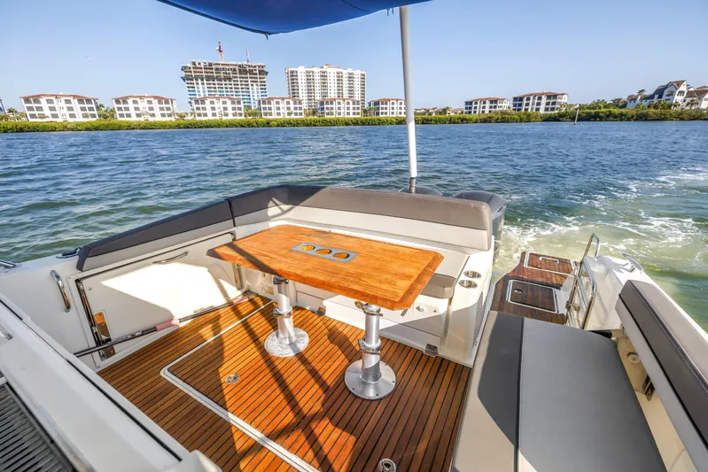  Yacht Photos Pics 2019 Jeanneau Leader 10.5 CC boat with teak deck and waterfront view.