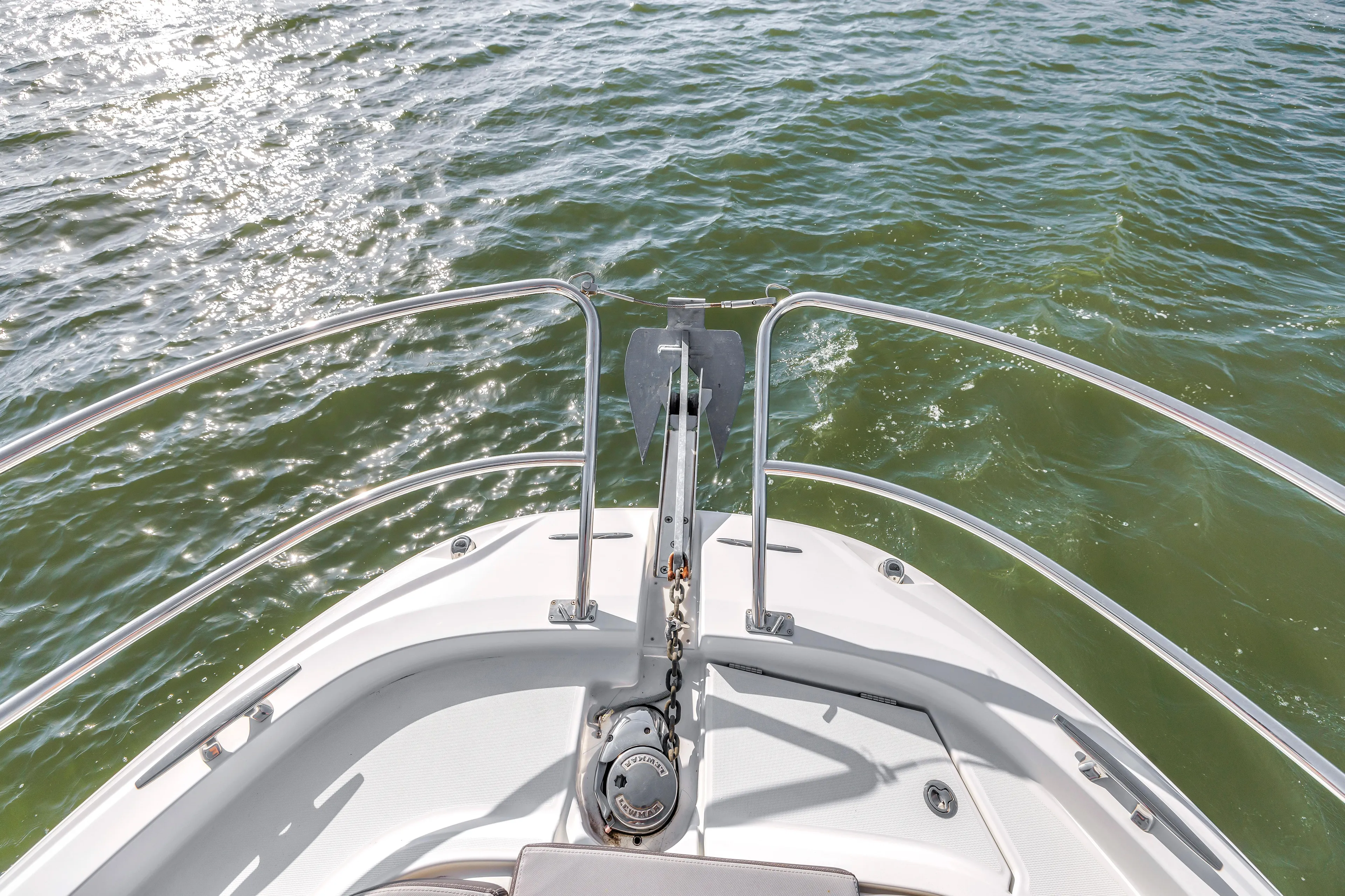  Yacht Photos Pics Bow view of 2019 Jeanneau Leader 10.5 CC on water.