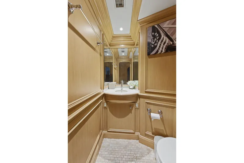 Savoir-faire Yacht Photos Pics Luxurious bathroom on 2002 Ocean Alexander 120 Megayacht with elegant wood paneling.