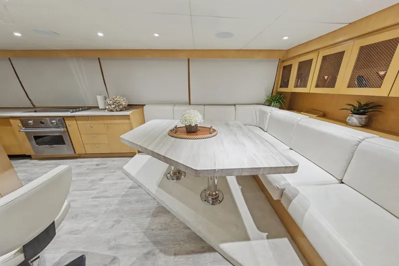 Savoir-faire Yacht Photos Pics Luxurious interior of 2002 Ocean Alexander 120 Megayacht with modern dining area and kitchen.