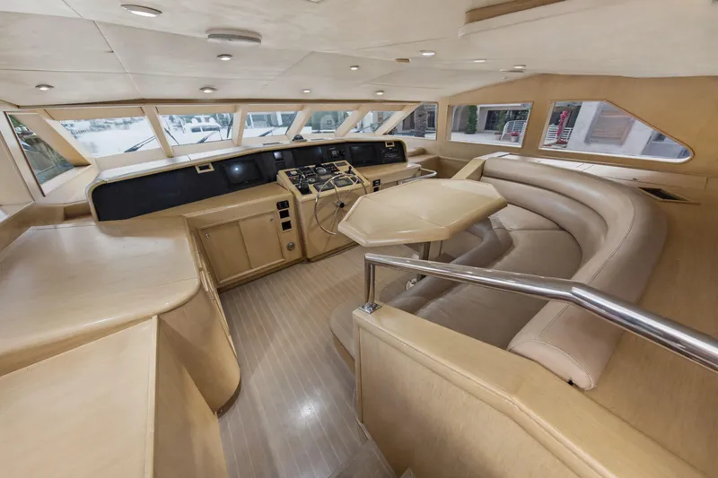 Savoir-faire Yacht Photos Pics Luxurious interior of 2002 Ocean Alexander 120 Megayacht with modern helm and seating area.