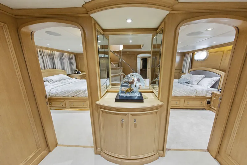 Savoir-faire Yacht Photos Pics Luxurious interior of 2002 Ocean Alexander 120 Megayacht with elegant bedrooms and wooden decor.