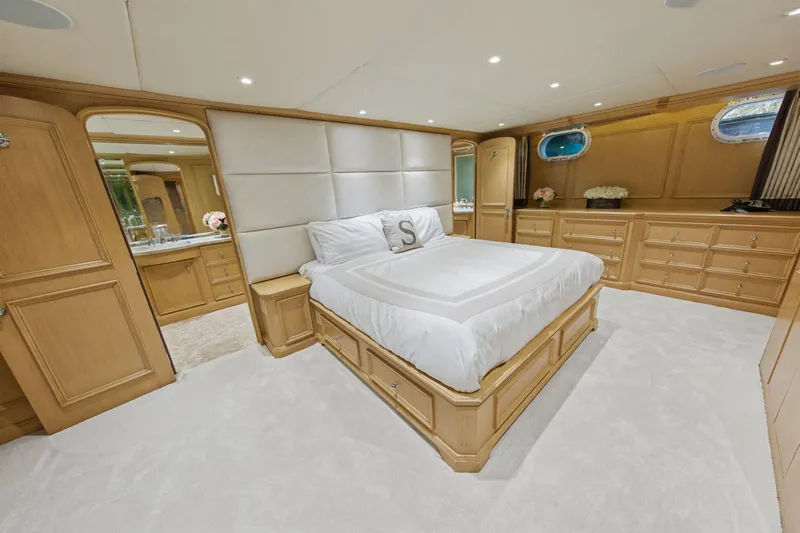 Savoir-faire Yacht Photos Pics Luxurious bedroom interior of 2002 Ocean Alexander 120 Megayacht with elegant wood furnishings.