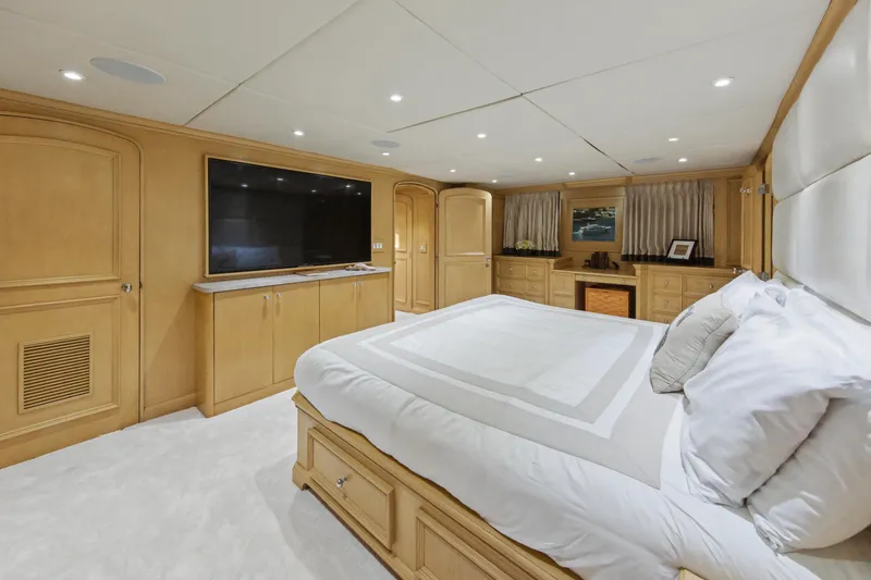 Savoir-faire Yacht Photos Pics Luxurious bedroom interior of 2002 Ocean Alexander 120 Megayacht with elegant wood finishes.