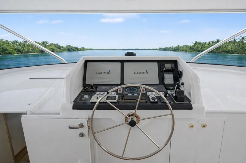 Savoir-faire Yacht Photos Pics Pilothouse of 2002 Ocean Alexander 120 Megayacht with Garmin navigation system.