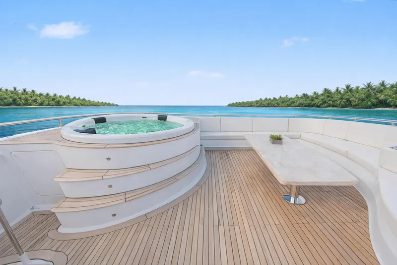 Savoir-faire Yacht Photos Pics Luxurious Ocean Alexander 120 Megayacht deck with jacuzzi and seating, 2002 model.