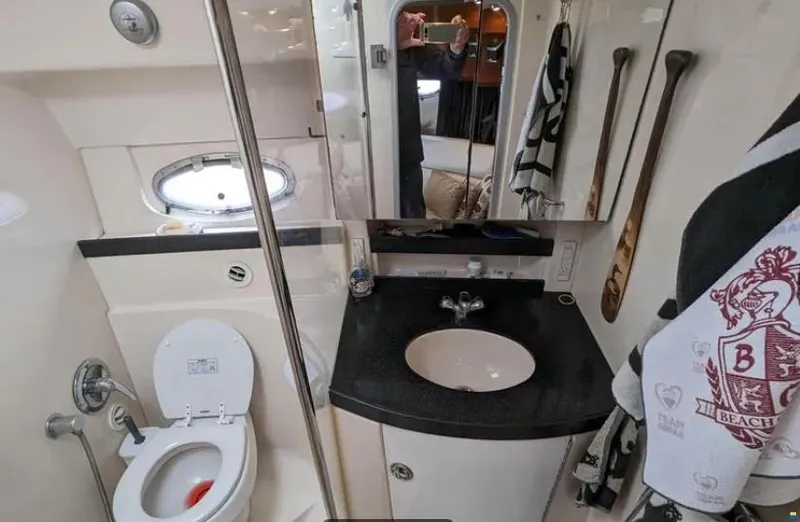  Yacht Photos Pics 2008 Regal Commodore 3760 IO yacht bathroom with sink, toilet, and mirror.