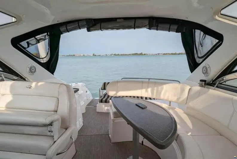  Yacht Photos Pics 2008 Regal Commodore 3760 IO yacht interior with elegant seating and table, overlooking serene water.