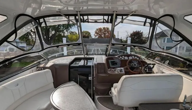  Yacht Photos Pics Interior view of 2008 Regal Commodore 3760 IO yacht cockpit with steering wheel and seating.