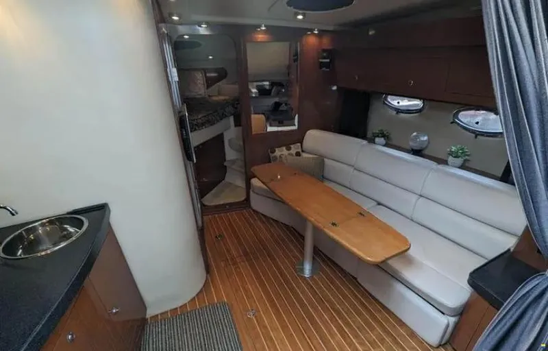  Yacht Photos Pics 2008 Regal Commodore 3760 IO interior with seating, table, and kitchenette.