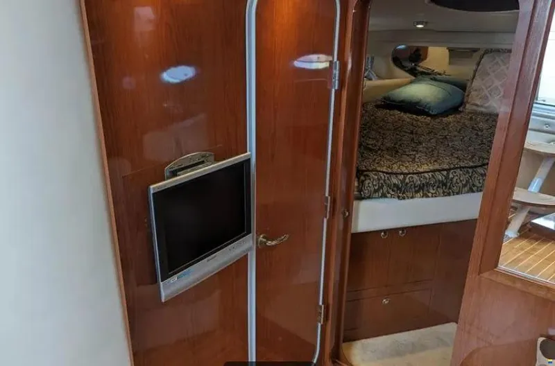  Yacht Photos Pics 2008 Regal Commodore 3760 IO cabin interior with TV and cozy bed.