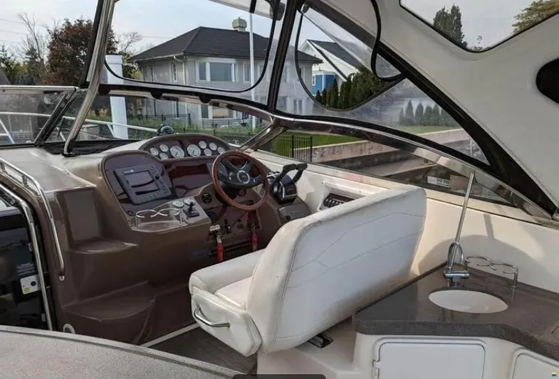  Yacht Photos Pics 2008 Regal Commodore 3760 IO boat interior with helm, steering wheel, and seating.