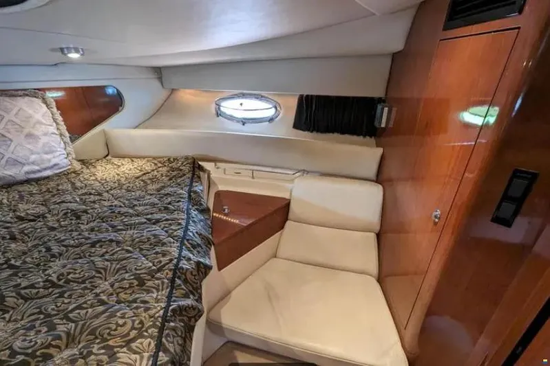  Yacht Photos Pics 2008 Regal Commodore 3760 IO cabin interior with bed and seating area.