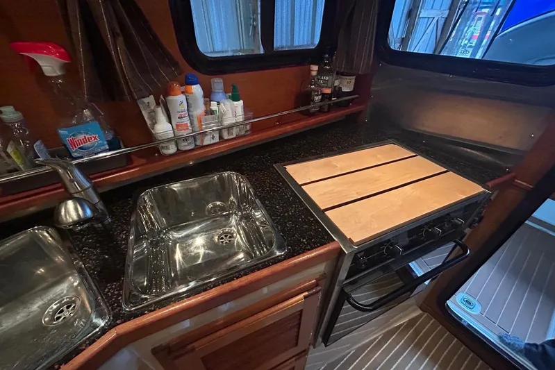 Triton Yacht Photos Pics 2011 Ranger Tugs R-29 kitchen with sink, stove, and countertop essentials.