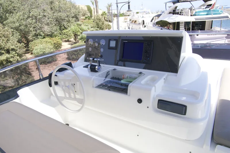 Antonina Yacht Photos Pics Helm of 2010 Ferretti Yachts 800 with navigation controls and steering wheel.