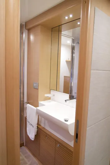 Antonina Yacht Photos Pics Luxurious bathroom in 2010 Ferretti Yachts 800, featuring modern sink and elegant wood finishes.