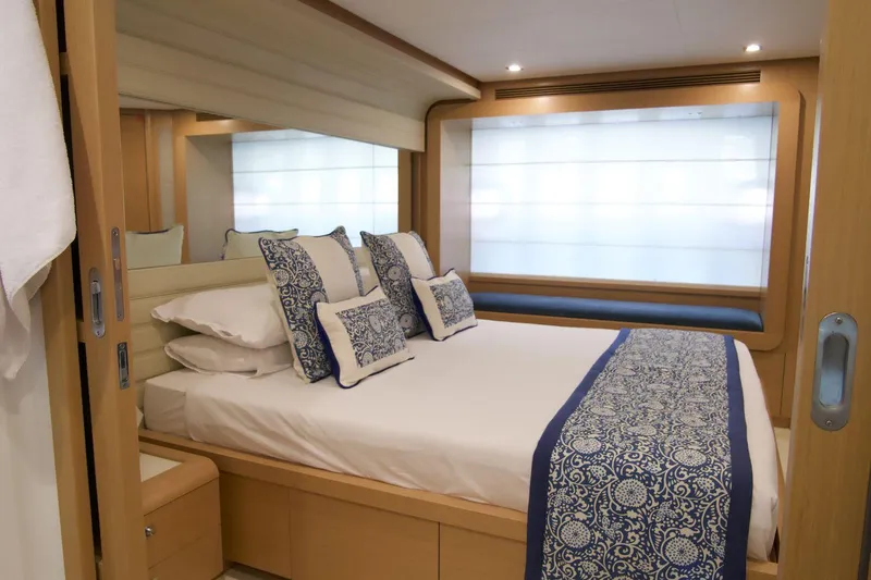 Antonina Yacht Photos Pics Luxurious bedroom interior of 2010 Ferretti Yachts 800 with elegant bedding and modern design.