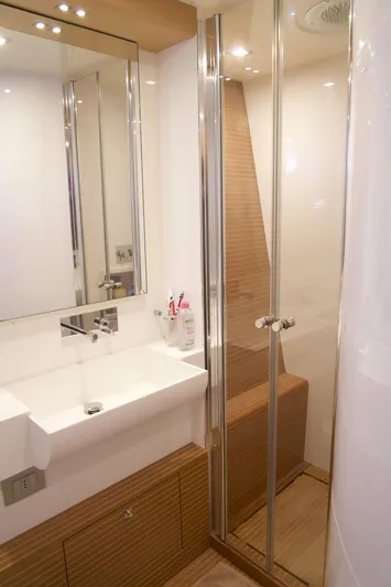 Antonina Yacht Photos Pics Luxurious bathroom in 2010 Ferretti Yachts 800, featuring modern sink and glass shower.