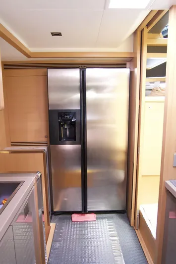 Antonina Yacht Photos Pics Modern kitchen interior on a 2010 Ferretti Yachts 800, featuring a stainless steel refrigerator.
