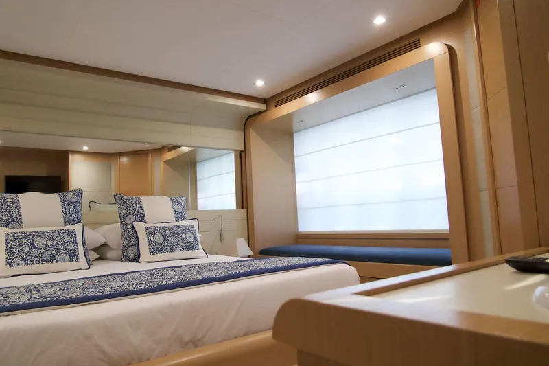 Antonina Yacht Photos Pics Luxurious bedroom interior of 2010 Ferretti Yachts 800 with elegant bedding and modern design.