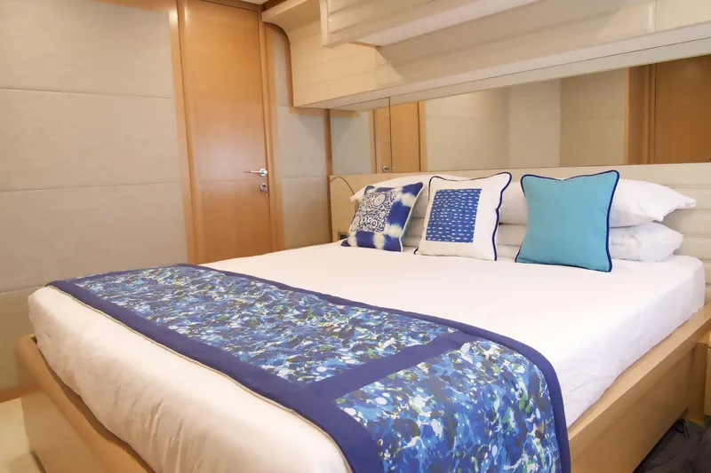 Antonina Yacht Photos Pics Luxurious bedroom interior on a 2010 Ferretti Yachts 800, featuring elegant blue accents.