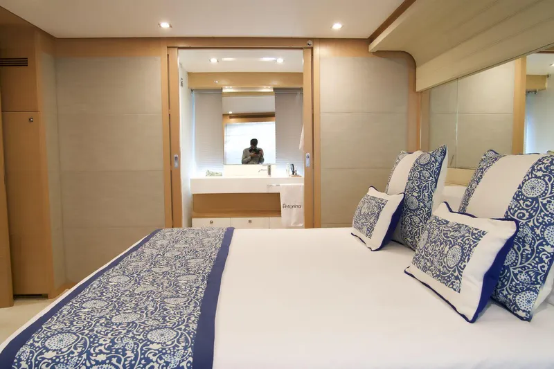 Antonina Yacht Photos Pics Luxurious bedroom interior of 2010 Ferretti Yachts 800 with elegant blue and white decor.
