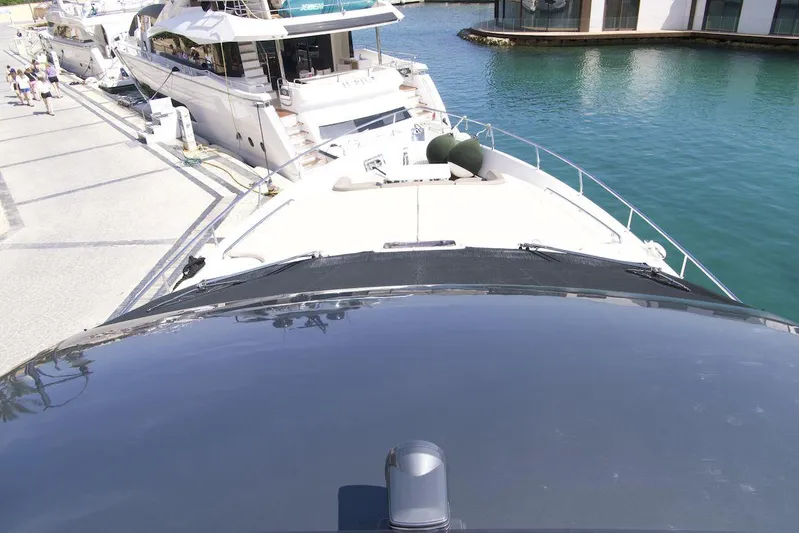 Antonina Yacht Photos Pics Luxury Ferretti Yachts 800, 2010 model, docked at marina with clear blue water.