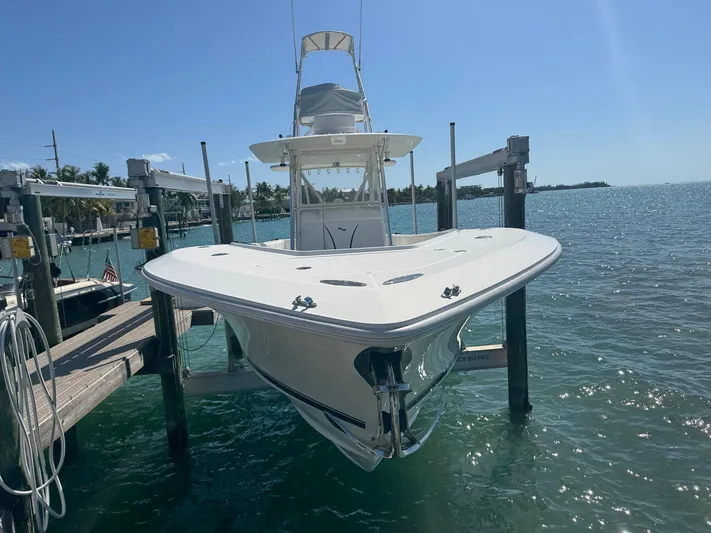 Warbird Yacht Photos Pics 2014 SeaVee 390B Center Console boat docked on a sunny day.