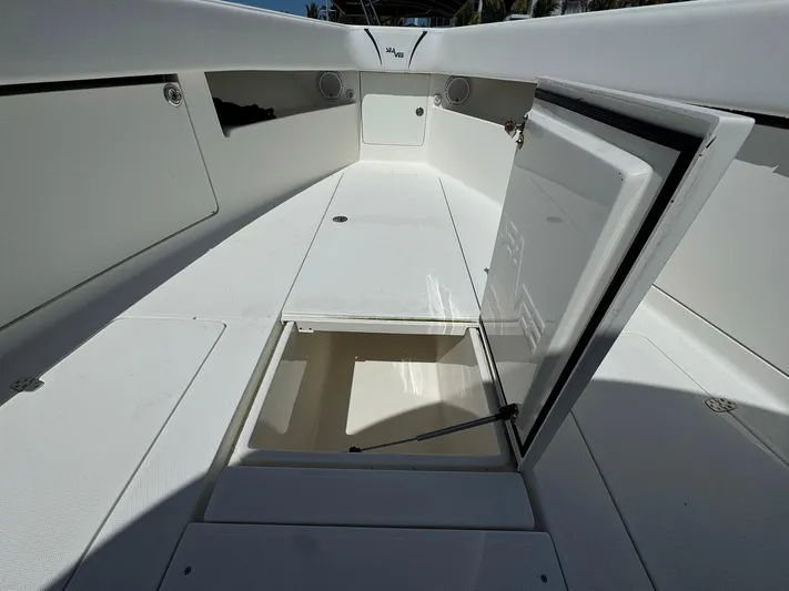 Warbird Yacht Photos Pics 2014 SeaVee 390B Center Console boat interior with open storage compartments.