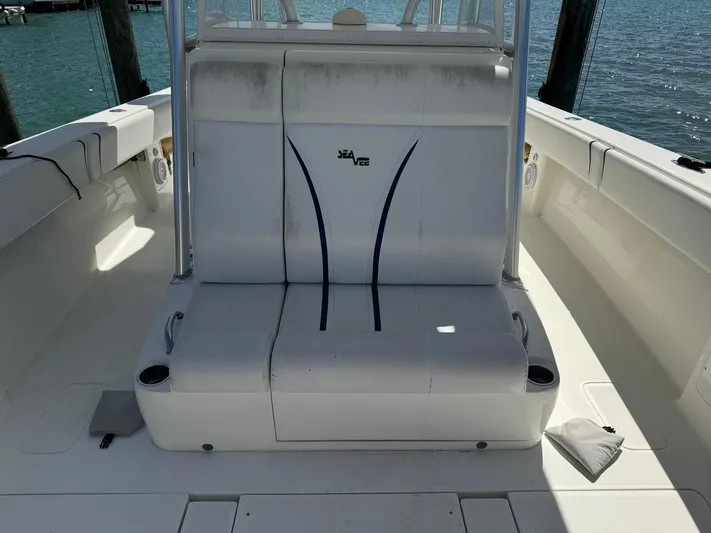 Warbird Yacht Photos Pics 2014 SeaVee 390B Center Console boat interior with white seating and cup holders.