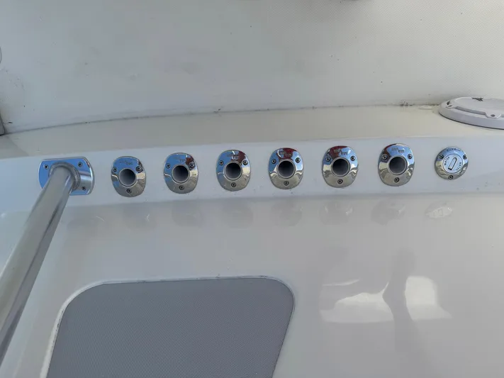Warbird Yacht Photos Pics 2014 SeaVee 390B Center Console boat with multiple rod holders on deck.
